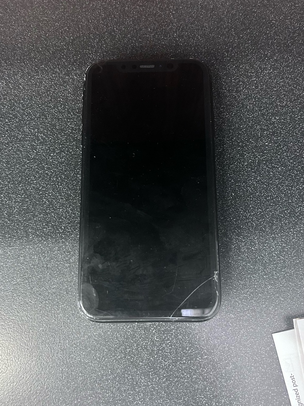 Apple Black Front-Facing Smartphone with Minor Screen Crack